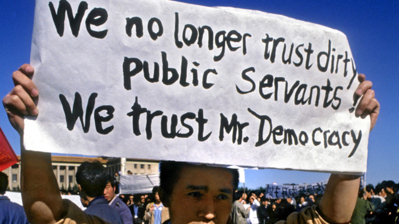 Students' protester holding sign 