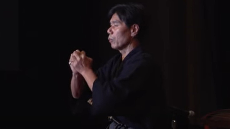 Jinichi Kawakami meditates hands clasped