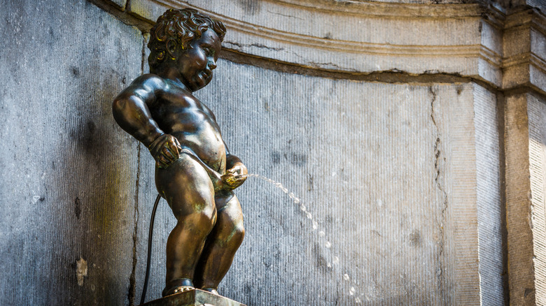 Manneken Pis (Little man Pee) or le Petit Julien, a landmark small bronze sculpture in Brussels, Belgium