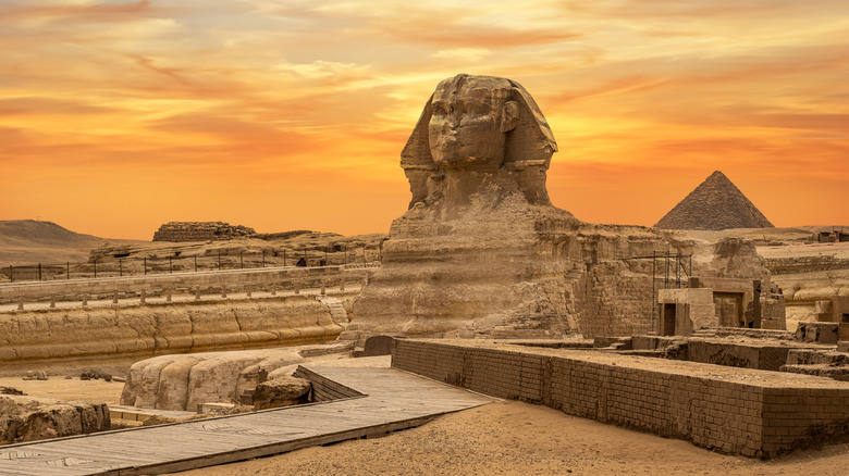 Landscape with Egyptian pyramids, Great Sphinx and silhouettes Ancient symbols and landmarks of Egypt