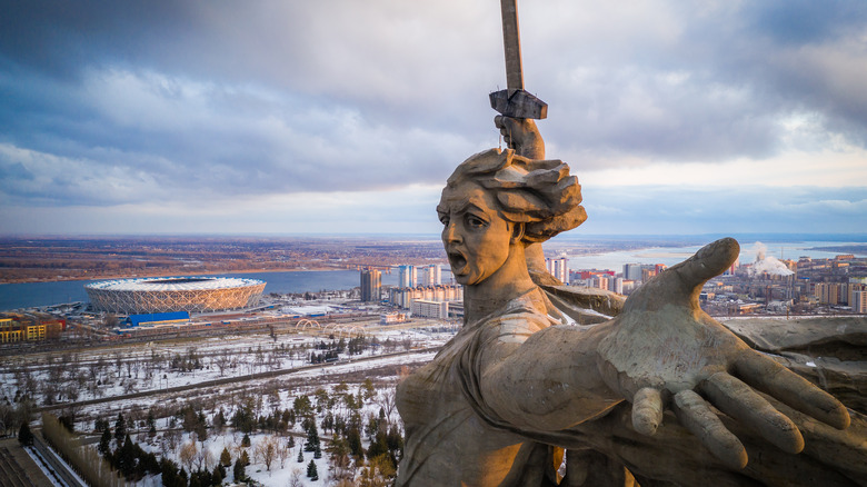 The Motherland Calls (Rodina-mat zovet) on the top of the Mamaev Hill and the football stadium Volgograd Arena built for the World Cup