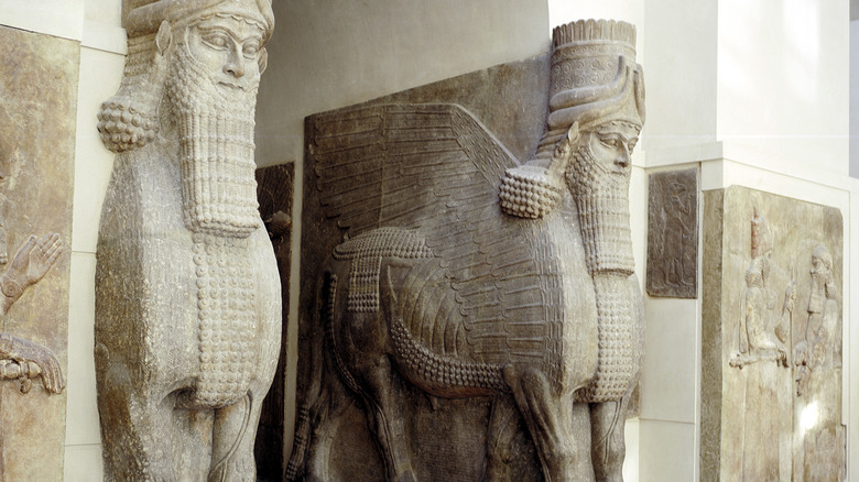 Assyrian sculptures of human-headed winged bulls at the palace gateway, Palace of Sargon II, Khorsabad, c8th century BC