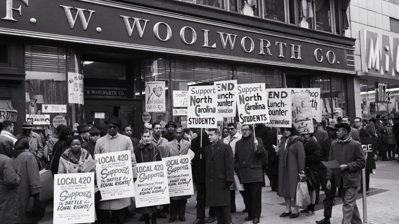 protestors picketing in front of Woolworth's