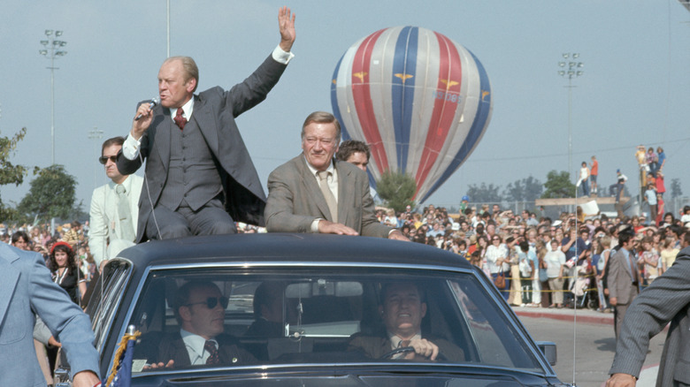 President Ford John Wayne in car