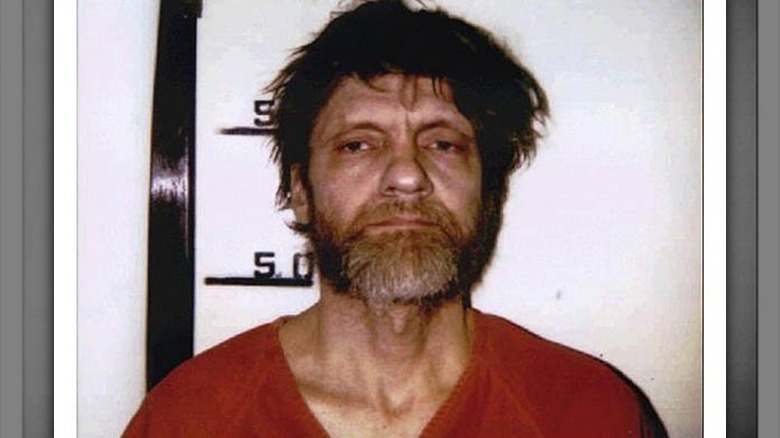 Ted Kaczynski mugshot beard wearing prison uniform