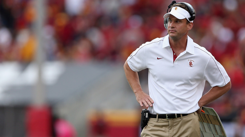 Lane Kiffin on the field with usc head coach