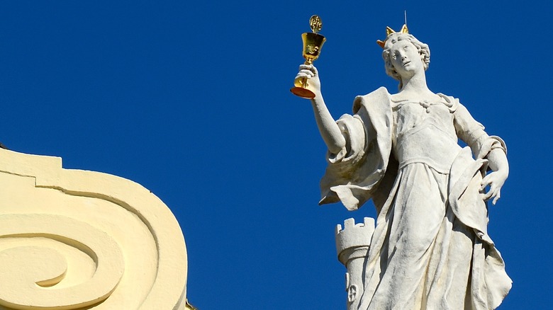 saint barbara sculpture with tower