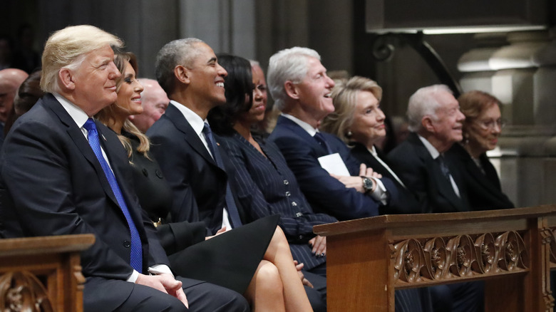 Presidents Trump, Obama, Clinton, and Carter sat smiling in church