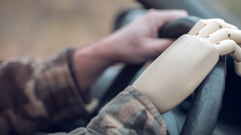 Amputee driving a vehicle