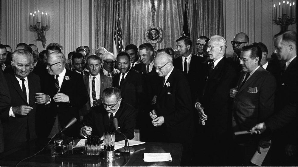 Lyndon Johnson signing Civil Rights Act