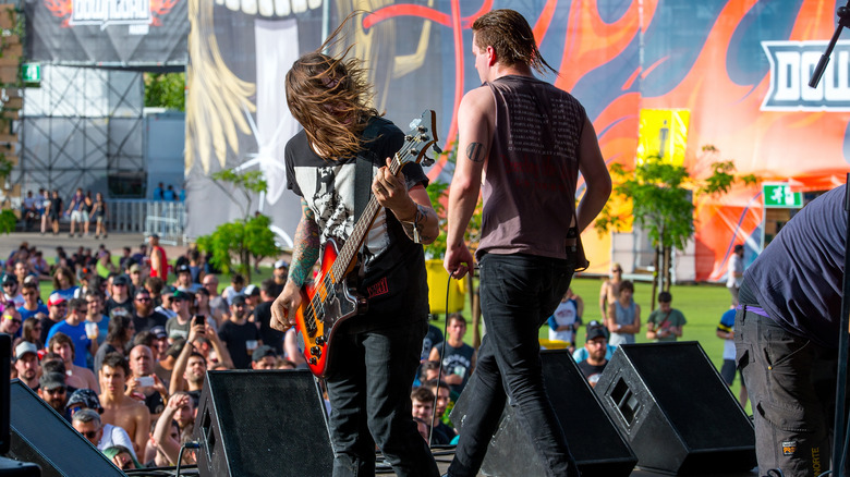 Deafheaven onstage outdoors at festival