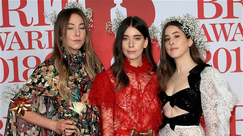 HAIM posing at Brit Awards