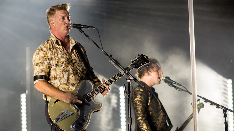 Queens of the Stone Age performing