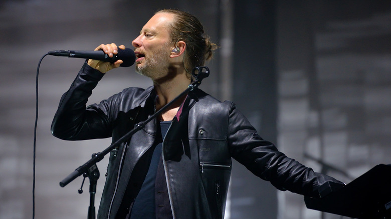Thom Yorke in leather with mic