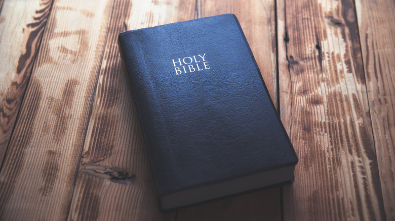 holy bible on a wooden table