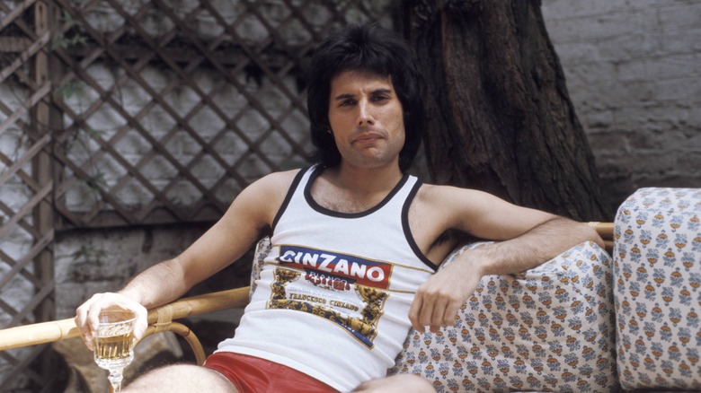 Freddie Mercury sitting on couch