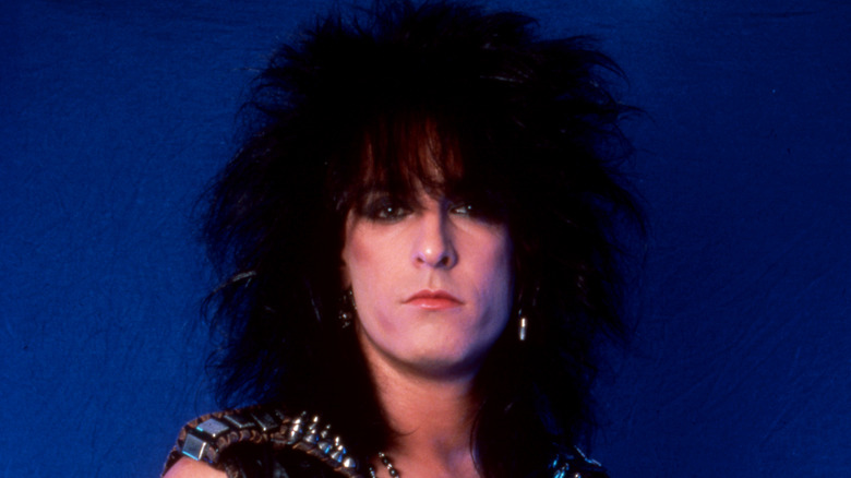 Nikki Sixx big hair looking serious