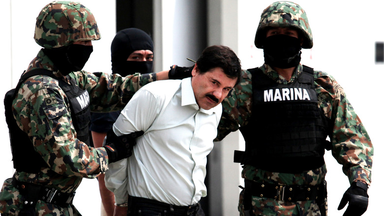 El Chapo moustache white shirt Marine escort