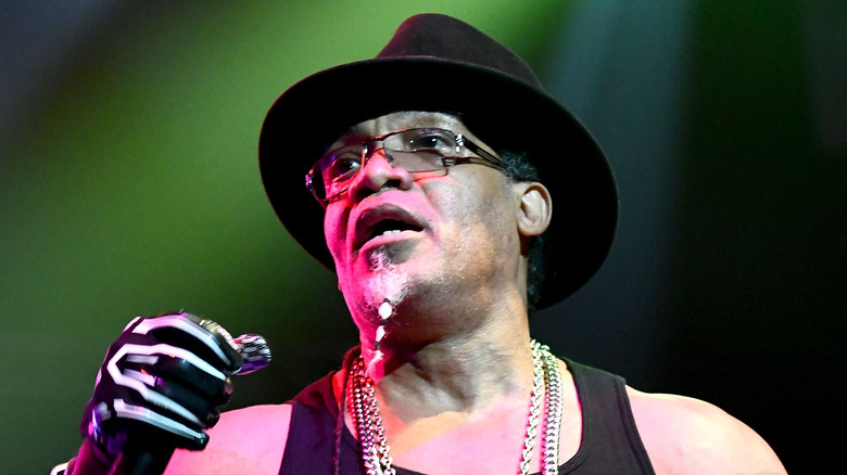 Melle Mel performing onstage black hat