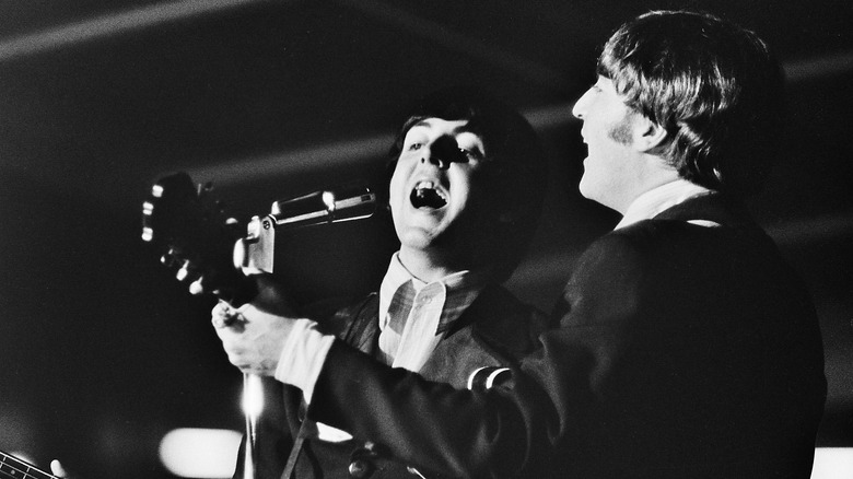 Paul McCartney and John Lennon perform