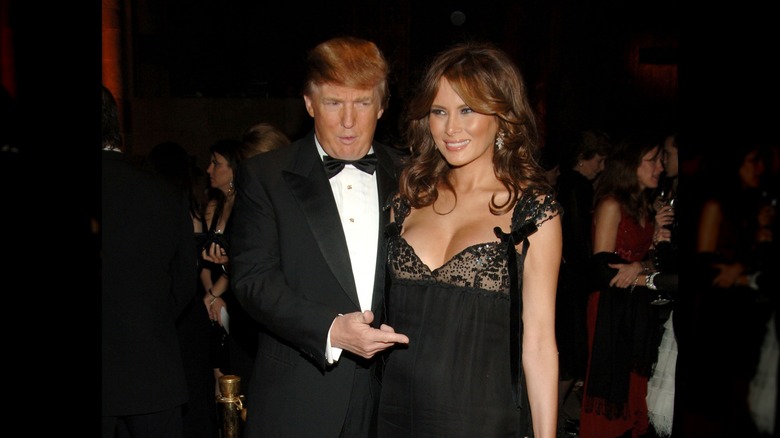 Donald Trump pointing at Melania Trump's pregnant belly