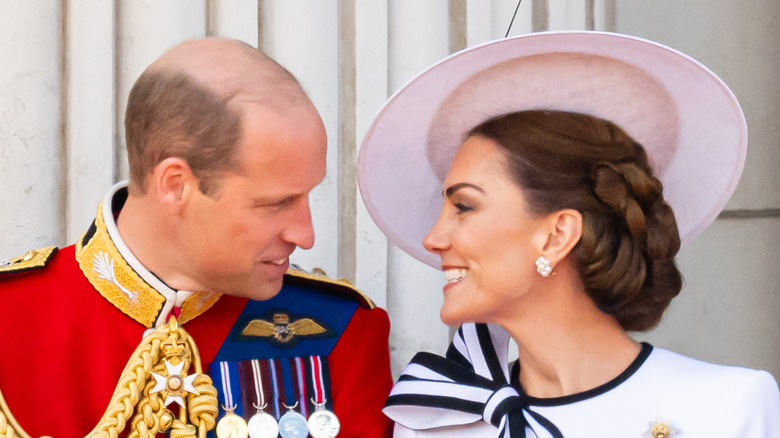 Prince William and Kate Middleton in regalia on balcony