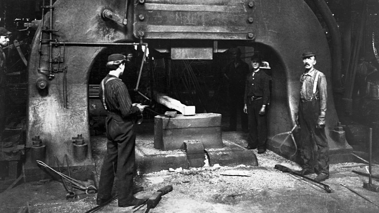 steel workers in mill