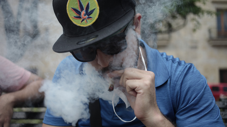 Cannabis hat man smoking marijuana