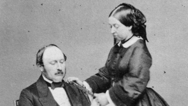 Queen Victoria with hand on Prince Albert's shoulder