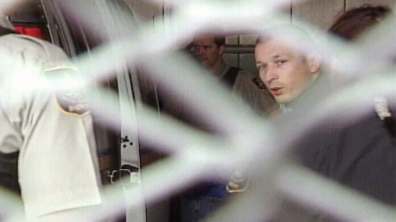 Christopher Rocancourt being taken to jail