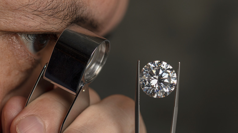 guy looking at a diamond