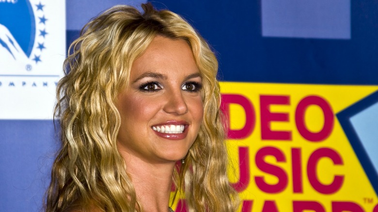 Britney Spears smiling with wavy blond hair