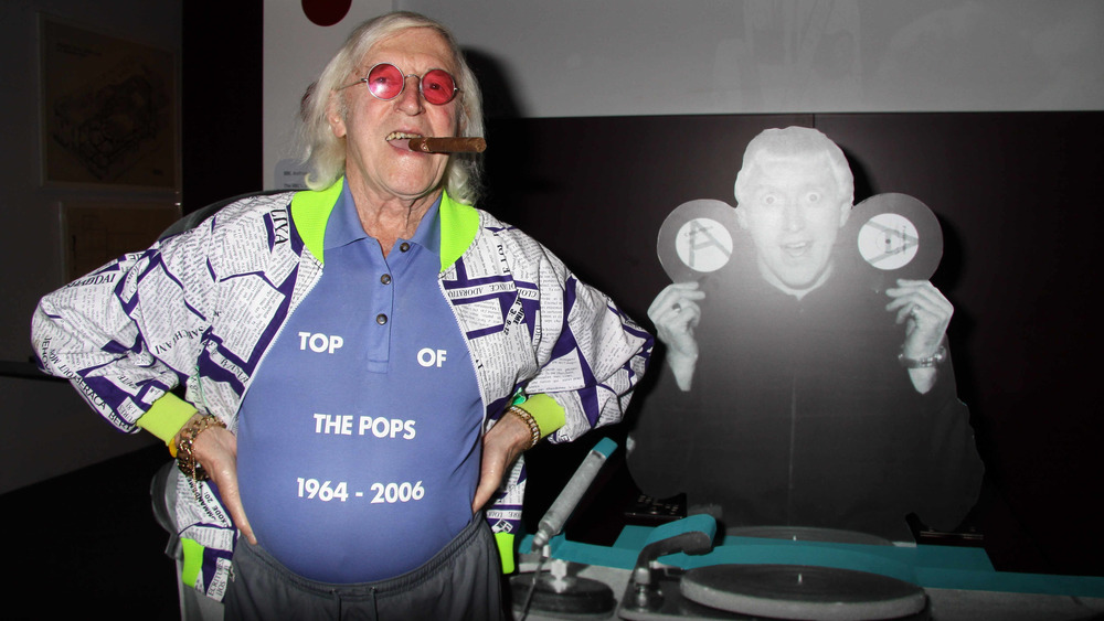 Jimmy savile with cigar in mouth