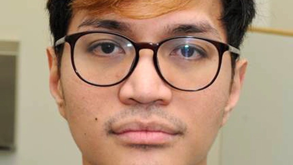 Reynhard Sinaga wearing glasses