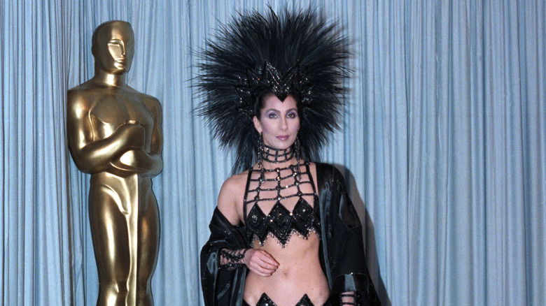 Cher black costume head dress at Oscars