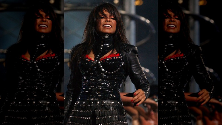 Janet Jackson singing black costume