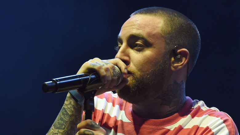 Mac Miller on stage striped shirt