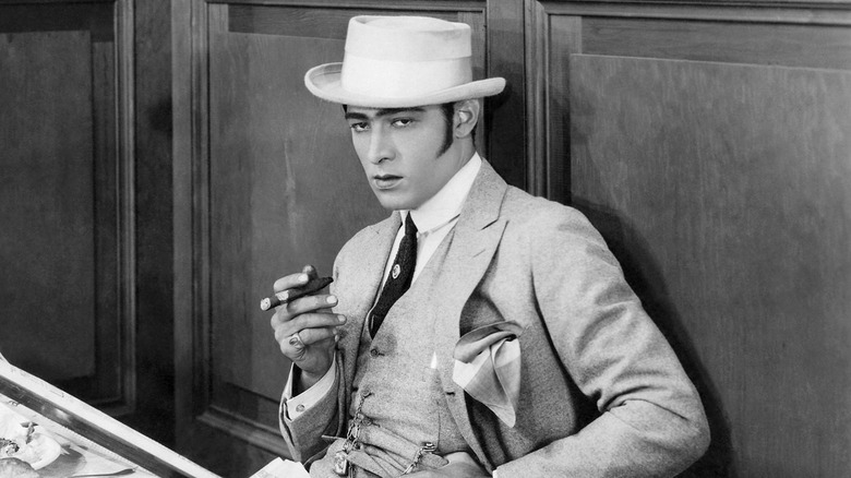 Rudolph Valentino smoking cigar