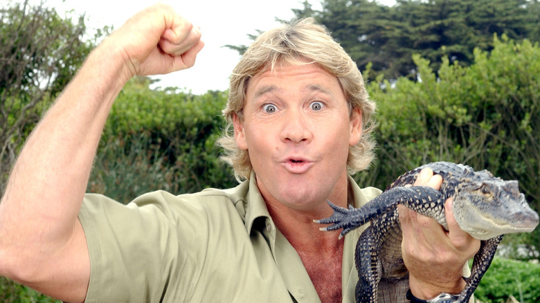 Steve Irwin holding a crocodile