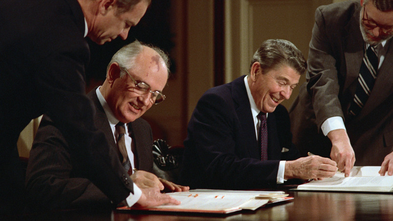 Reagan and Gorbachev signing anti-nuclear treaty