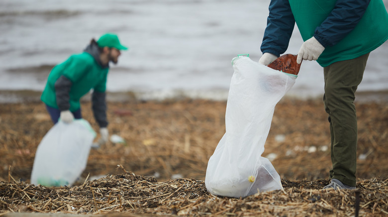 Collecting trash near river