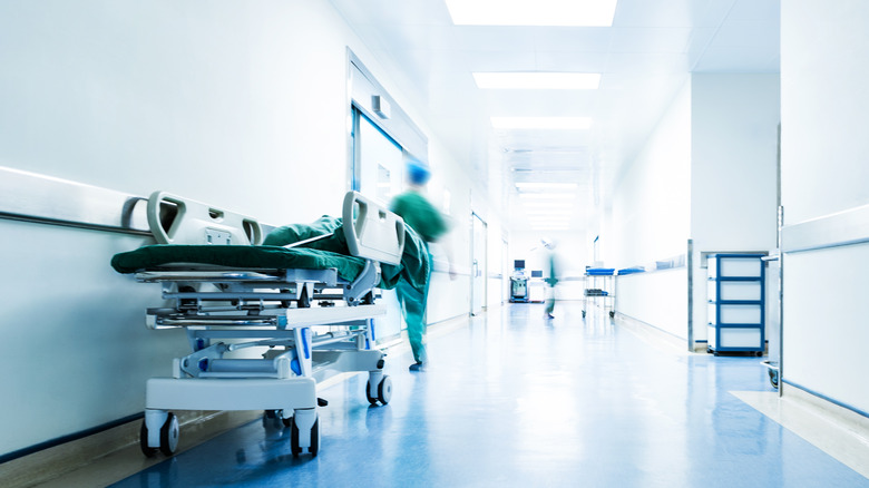 Hospital hallway with blurred figures