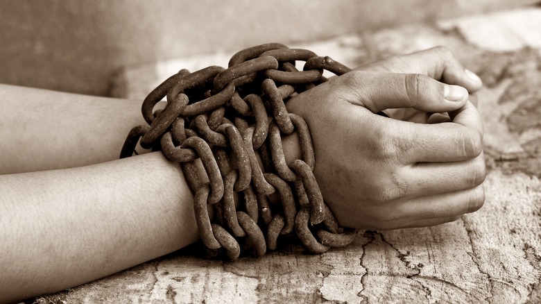 Woman hands in chains