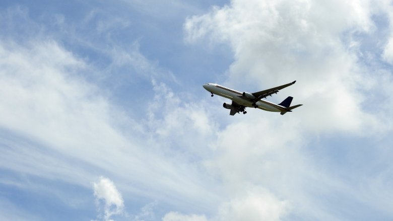 plane flying blue skies