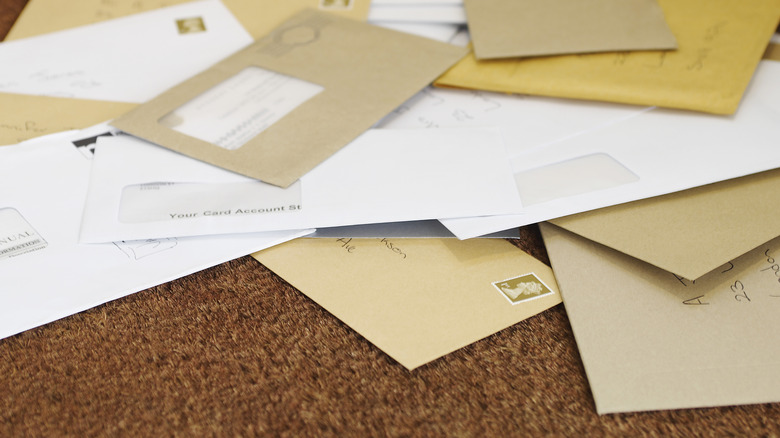 Pile of mail on doormat 