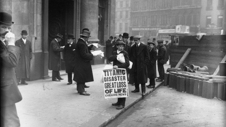 boy selling newspapers