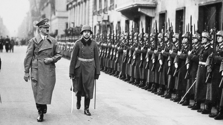 Hitler inspecting troops with Goering