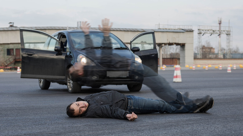 Person in front of car