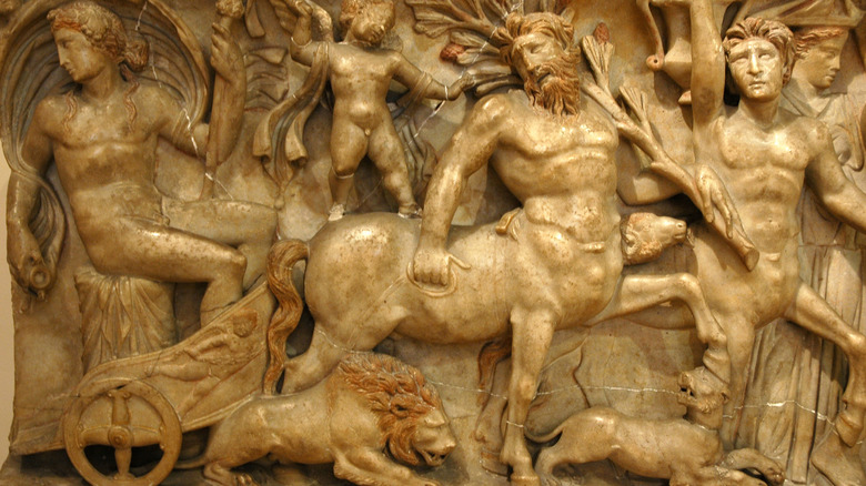 relief showing dionysus and a centaur pulling his chariot