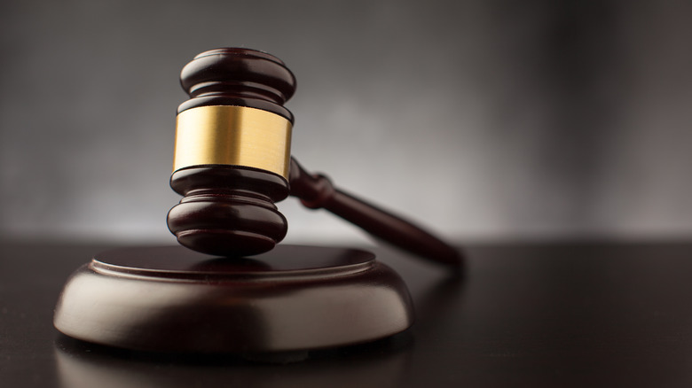 Wooden gavel on shiny table